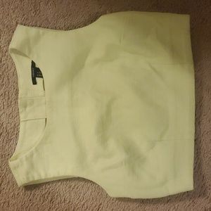 Yellow crop top with buttons on the back.